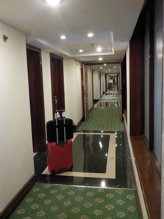 Hotel's corridor. In order to make this picture more interesting I added my red suitcase with a laptop bag